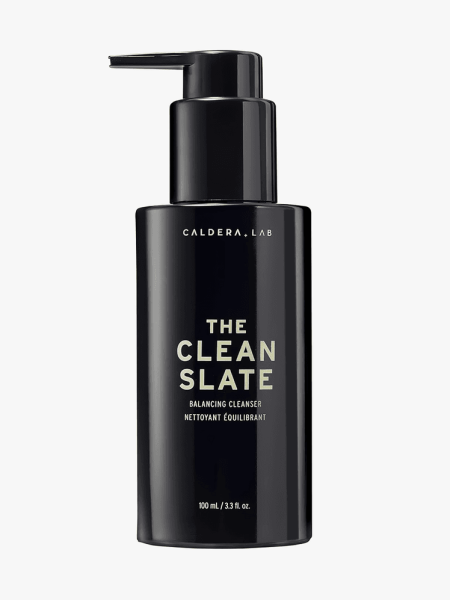 The Clean Slate Purifying Gentle Facial Cleanser in branded black bottle with pump on light gray background
